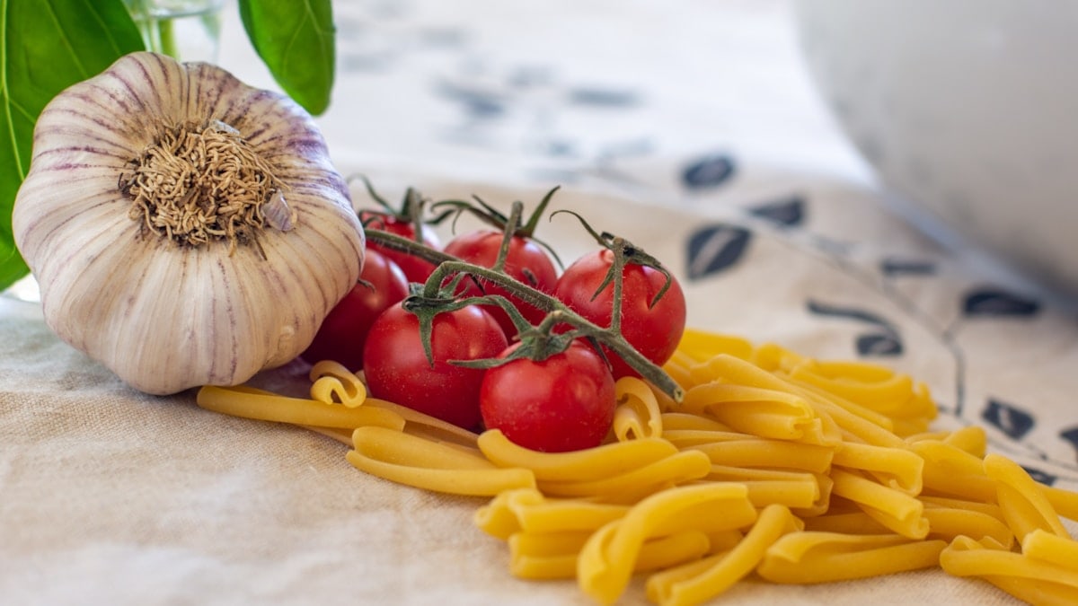 Pasta, tomato, and garlic. Ready to cook.